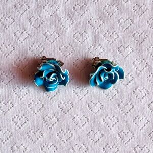 blue clip on rose earrings